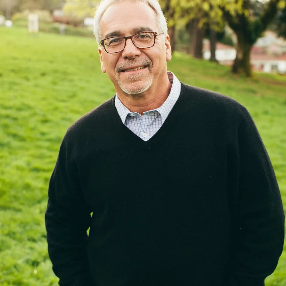 Active older man smiling outdoors, moving comfortably on a daily walk