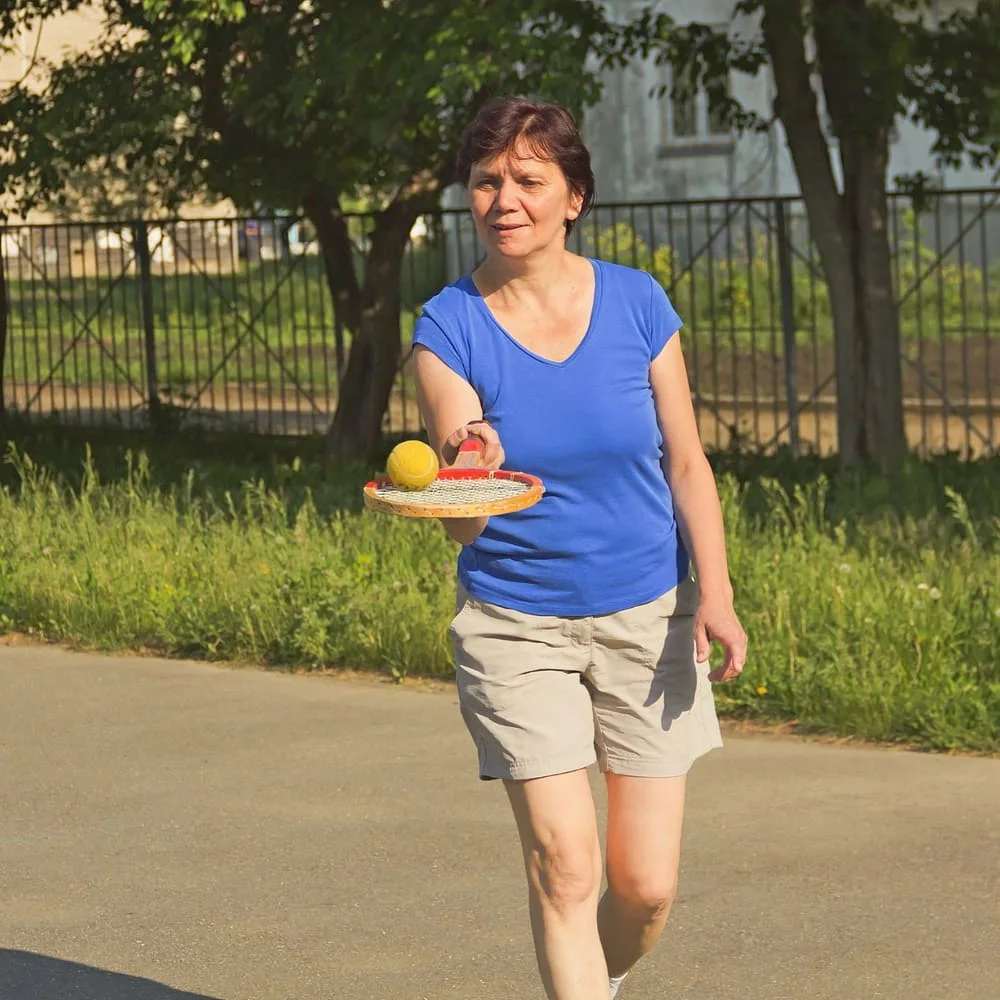 Woman carrying fresh food on an active daily walk outdoors